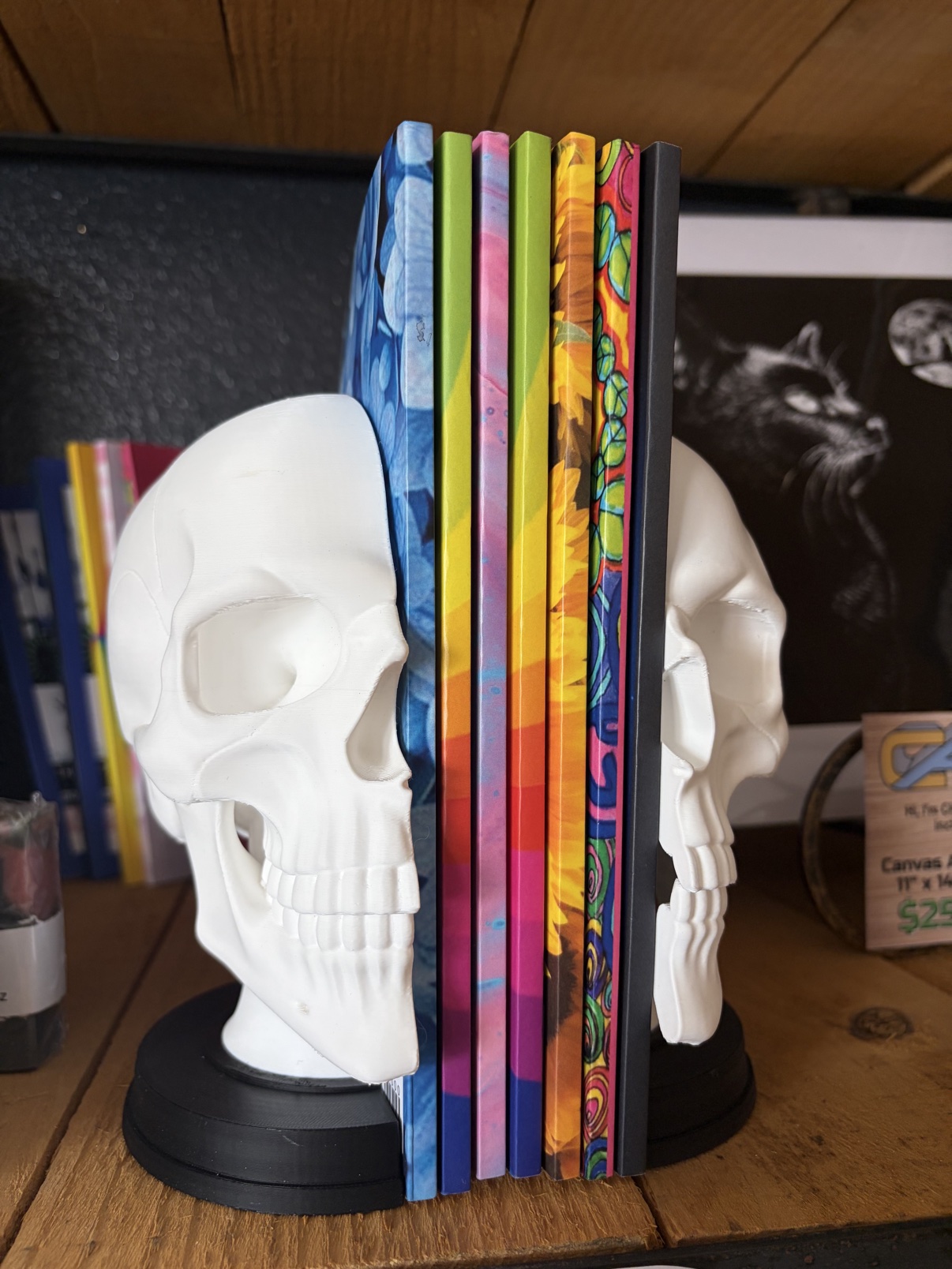 Skull bookends holding books